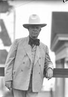 [Unidentified elderly man in suit, western hat and large bow tie]