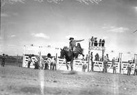 [John St. Clair riding at Marias Rodeo]