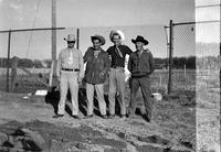 [Four men in western wear including Tennessee Ernie Ford & possibly William Boyd standing]