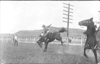 [Unknown cowboy, saddle bronc riding]