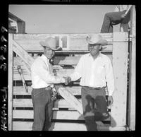 Hank Christensen congradulating Jerry Hixon on winning Saddle Bronc