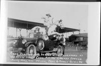 Chief jumping auto loaded with passengers at American Legion Conv, Kansas City MO
