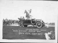 Leonard Stroud's horse "Black Diamond" jumping auto New York State Fair 1923