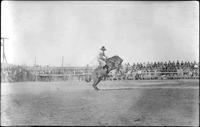 [Unknown cowboy, saddle bronc riding]