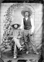 Two cowboys wearing large hats