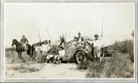 Large hunting party with Hudson Speedwagon loaded with carcasses