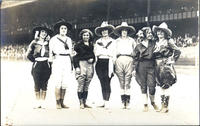 Seven cowgirls in the arena