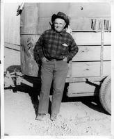 Bob Crosby in front of horse trailer