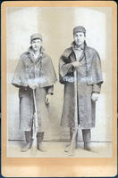 Two hunters with guns
