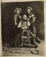 [3 Cowboy Musicians playing different instruments with each hand]