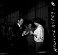 Richard Nixon signing autographs