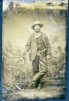 Cowboy wearing fringed chaps and military holster
