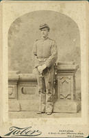 Man in uniform posing with sword