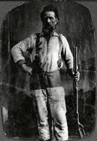Bearded man holding a lever action rifle
