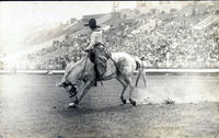 Bonnie McCarroll riding a saddle bronc