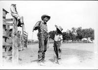 [Cowboy, probably Leonard Stroud, with two children]