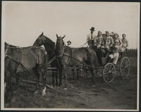 [101 Ranch baseball team, 11 men in wagon drawn by 4 horses, 1 woman on horseback]