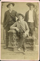 Three cowboys wearing Western suits