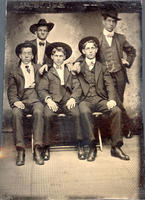 Portrait photograph of five men in cowboy hats