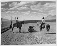 Cotton Lee with others roping calf