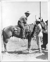 Dick Truitt on horse talking to unidentified man