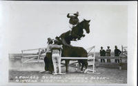 Leonard Stroud Jumping Black Diamond over Two Horses