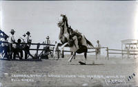 Leonard Stroud going under his horse, while at Full Speed