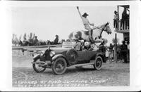 Leonard Stroud jumping "Chief" over loaded automobile