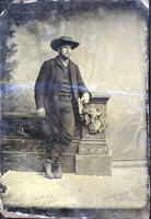 Man wearing cowboy-like boots and hat