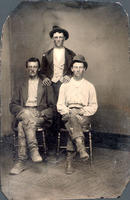 Portrait photograph of three western men in work or dress clothes