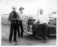 Everett Shaw, Lyman Betty and Dick Truitt posing in front of car