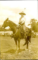 Probably Mabel Strickland posed atop horse