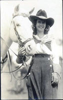 Rose Smith standing by horse