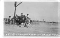 Leonard Stroud standing on head roping