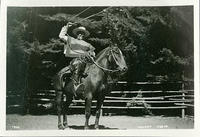 Chilean cowboy throwing a lasso from horseback