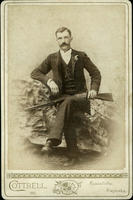Man posing with Winchester rifle