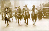 Group of cowboys & cowgirls led by Tex Austin