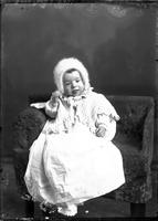 [Single portrait of an Infant in a chair]