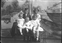 [Single portrait of three young Girls, one young Boy, and an Infant]