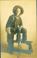 [Young cowboy with Remington pistol, spurs]