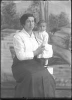 [Single portrait of a person and child]
