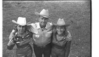 [Mary Louise Eskew, Junior Eskew, and Madonna Eskew pose for November 1969 Western Outfitter article]