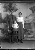 [Single portrait of  US Army person, people, and a child]