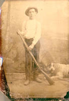 [Young hunter with rifle and dog]