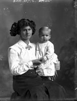 [Carte de Visite single portrait of a young Mother sitting & holding an Infant]