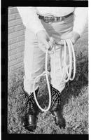 [Junior Eskew showing proper handling of coiled rope]