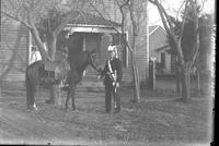 Wantland with horse in Masonic uniform with sword.