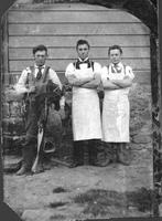 [Cowboy with saddle and two butchers]