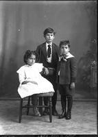 [Single portrait of two young Boys and a girl sitting]