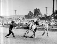 [Junior Eskew & Bud Mefford doing a double rope catch]